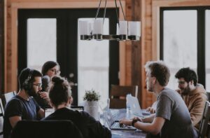 Advisor meeting institutional clients around a conference table